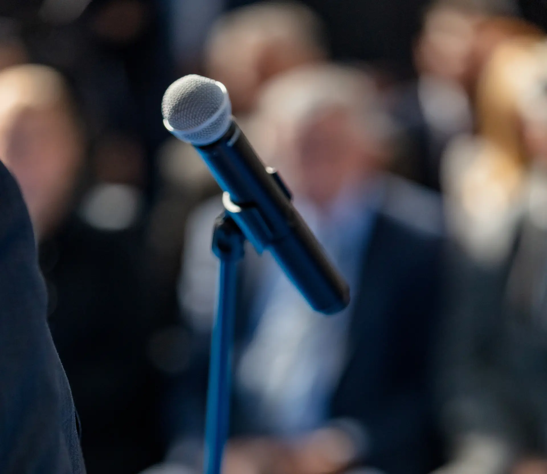 microphone with blurry background of people